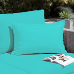 Deux coussins d'appoint décoratifs 60x35 cm en tissu bleu Caraïbes, déhoussables, pour décoration de jardin.