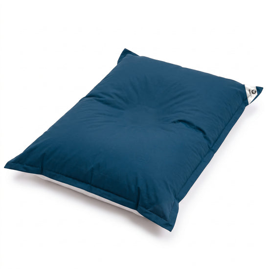 Petrol Blue giant floating bean bag on a white background, high-angle view