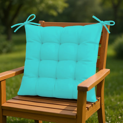 Quatre galettes de chaise 40x40 cm en tissu déperlant bleu Caraïbes pour intérieur et extérieur, avec attaches, pour fauteuils et canapés.