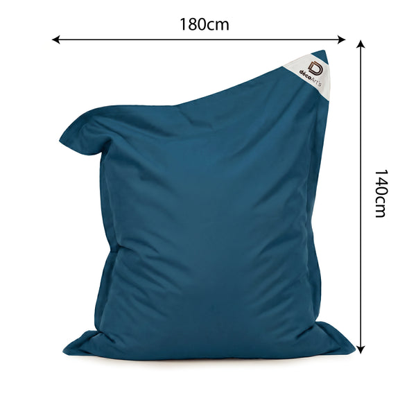 Ambiance jardin avec pouf bleu pétrole