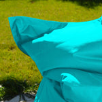 Housse de pouf géant XXL 180x140 cm en tissu bleu Caraïbes, déhoussable, pour intérieur et extérieur, de Deco-arts.fr.