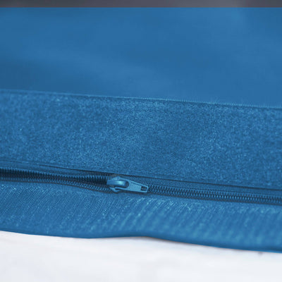 Pouf géant XXL 180x140 cm bleu pétrole pour extérieur, déhoussable et imperméable, mousse confortable, décor de salon ou jardin.